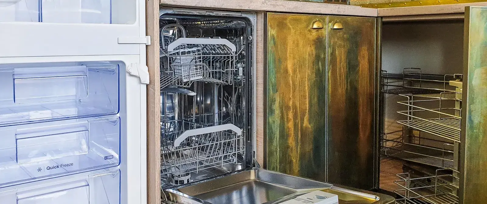 Open, empty dishwasher in a kitchen